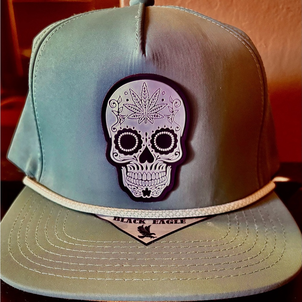 NWTS TEAL GREEN SNAPBACK HAT WITH WHITE SKULL AND ROPE ADORNING THE FRONT!!!